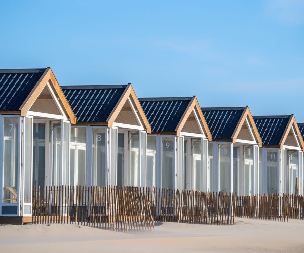 A beautiful shot of resting cabins on a sand beach